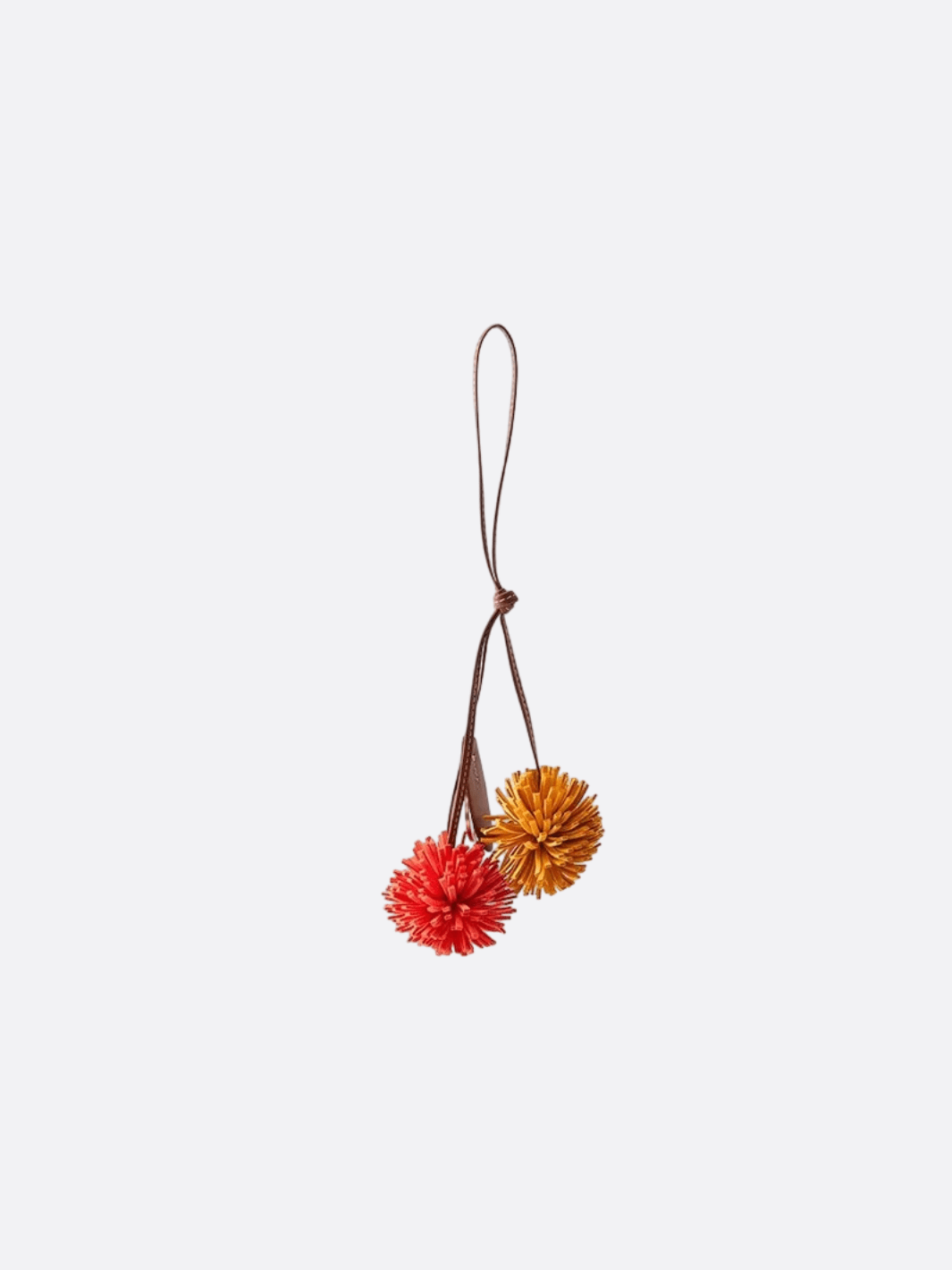 Bijou de sac pompon cuir rouge et orange