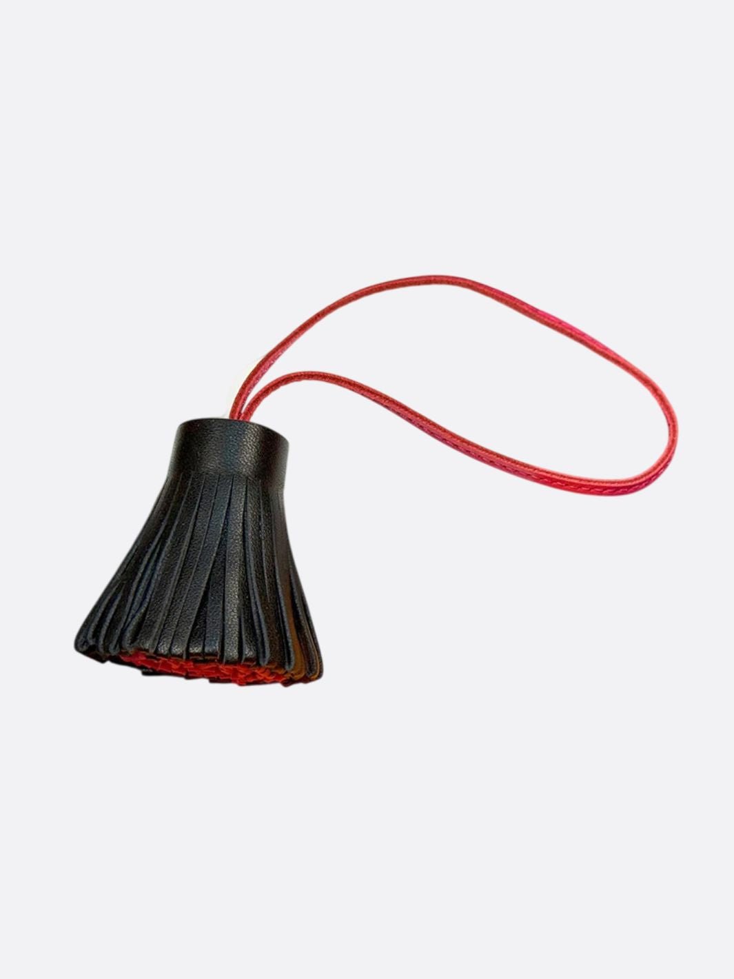pompon cuir noir et rouge