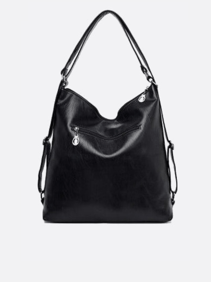 Leather shoulder bag that converts into a backpack<br>Orvane